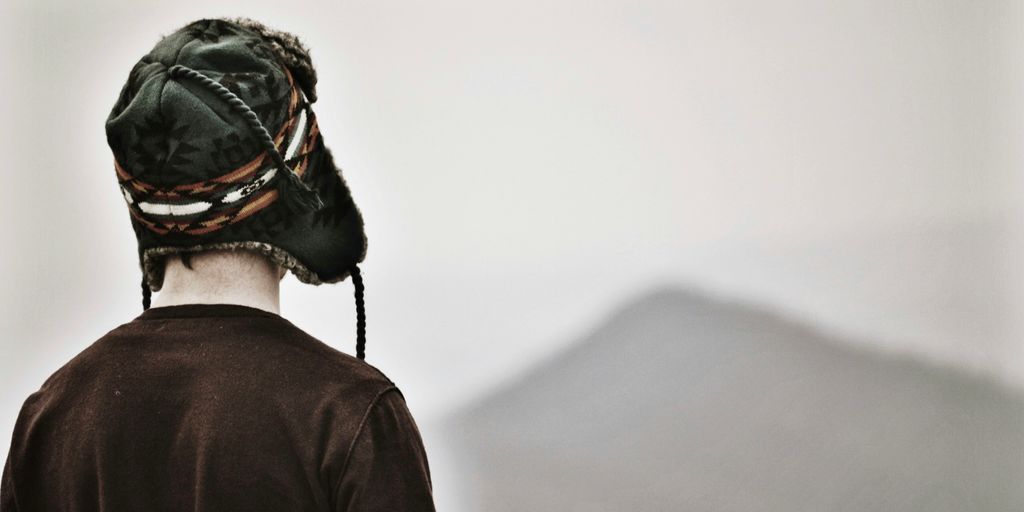 person wearing black chullo hat and black top