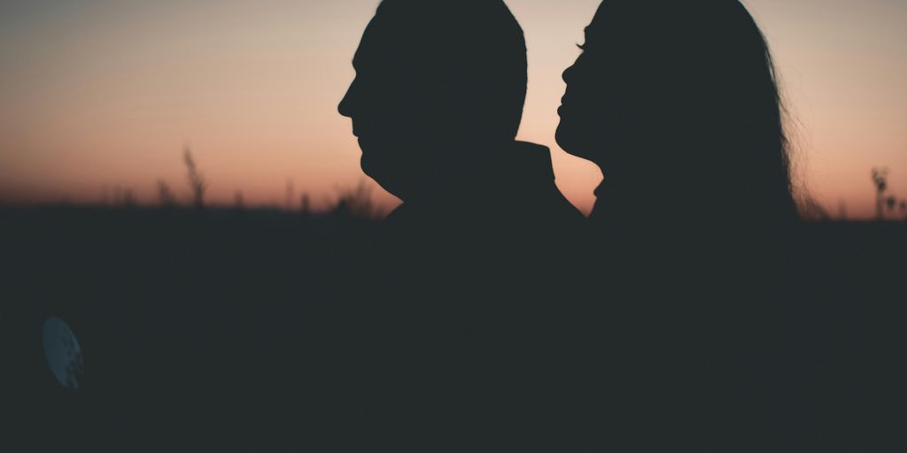 silhouette photography of man and woman