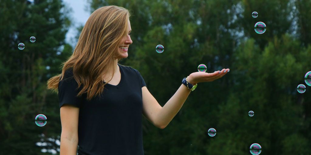 woman standing in front of bubbles